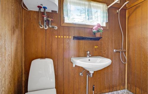 a bathroom with a toilet and a sink at Lovely Home In Slagelse With Kitchen in Slagelse