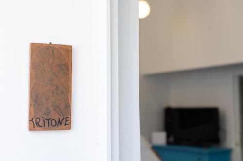 a door with a sign that reads return home at La Bella Annacapri in Anacapri