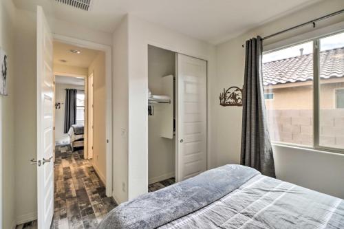 a bedroom with a bed and a window at Private Pool Stunning Goodyear Vacation Rental! in Goodyear