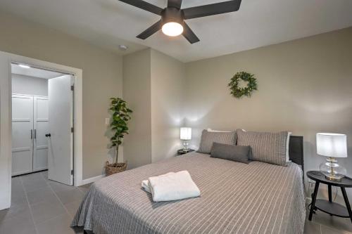 a bedroom with a bed and a ceiling fan at Pet-Friendly Phoenix Vacation Rental with Yard in Phoenix