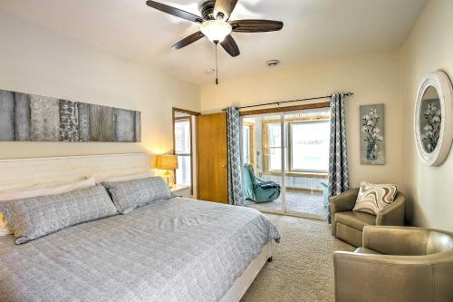 een slaapkamer met een bed en een plafondventilator bij Stunning Waterville Home on Tetonka Lake! 