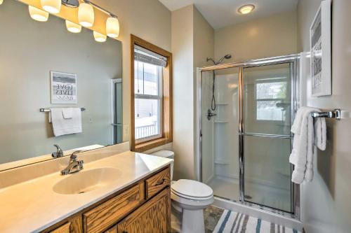 a bathroom with a sink and a shower and a toilet at Stunning Waterville Home on Tetonka Lake! in Waterville