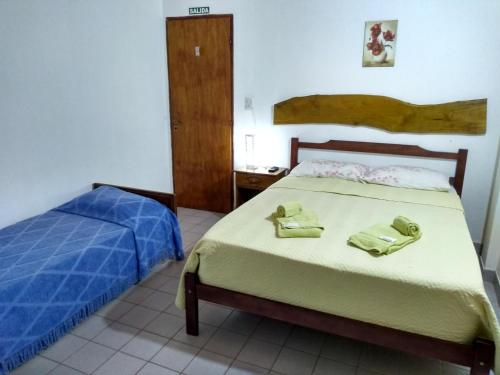 Un pat sau paturi într-o cameră la Hosteria Las Piedras