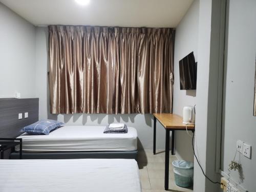 Postel nebo postele na pokoji v ubytování Haising Hotel