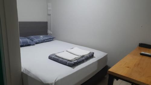 Postel nebo postele na pokoji v ubytování Haising Hotel