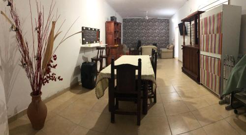 a dining room with a table and chairs in a room at J & S Casa de Alquiler Temporario in Santiago del Estero