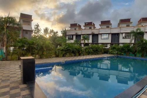 a view of a resort with a swimming pool at Vista Manor - 3 BHK with pool-1.5 hrs from Mumbai in Pālghar
