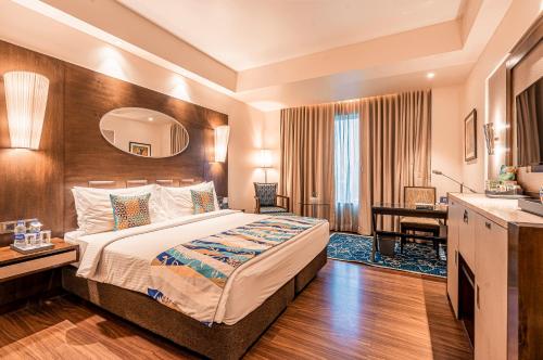 Postel nebo postele na pokoji v ubytování Fortune Park Pushpanjali, Durgapur - Member ITC Hotels' Group