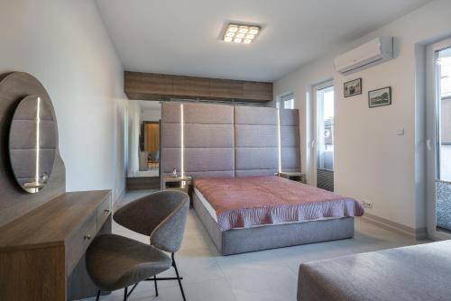 En eller flere senge i et værelse på Apartt Kościuszki