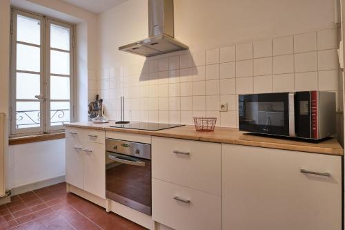 Kuchyň nebo kuchyňský kout v ubytování Appartement centre ville T3
