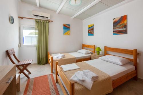 Posteľ alebo postele v izbe v ubytovaní Beach Pearl - Beach Front House with Private Pool