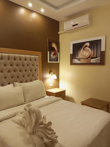 Postel nebo postele na pokoji v ubytování Mariam Hotel