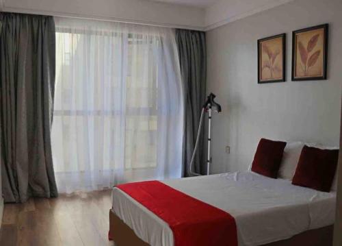 Postel nebo postele na pokoji v ubytování Joe Apartments