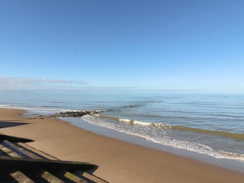 a view of the ocean from the beach at The Hollies in Prestatyn