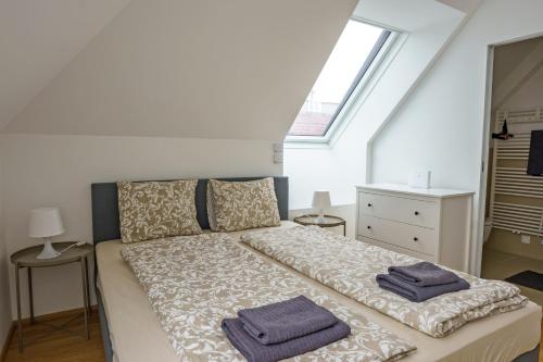 Una cama o camas en una habitación de Vienna City Apartments Belvedere
