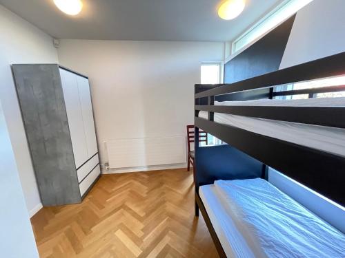 a room with two bunk beds and a mirror at Big Villa centrally located in Reykjavik in Reykjavík