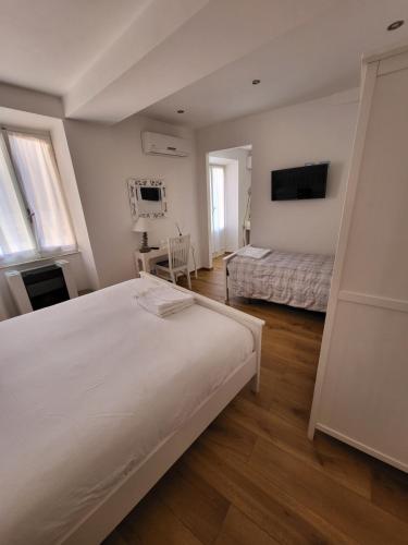 Postel nebo postele na pokoji v ubytování Affittacamere Il Timone