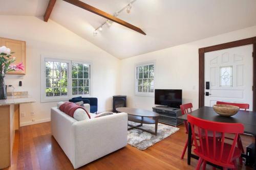 a living room with a white couch and a table at Berkeley Cottage, Comfy, Stylish Good Wi-Fi in Berkeley