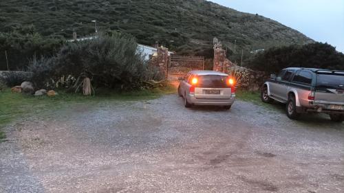 a truck parked in a driveway with its lights on at Agriturismo Glamping Erbe Matte in SantʼAntìoco