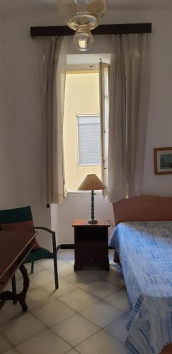 Postel nebo postele na pokoji v ubytování Casa vacanze Cagliari