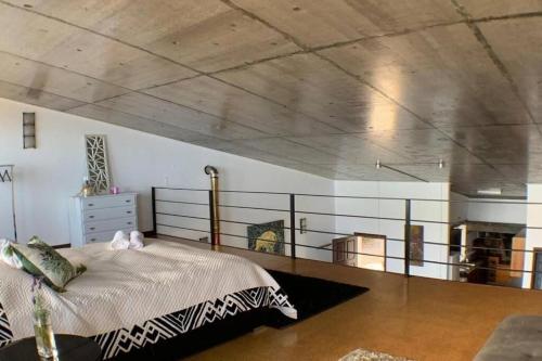 a bedroom with a bed and a fireplace at Sunrise House Azores - jacuzzi in Senhora da Nazaré