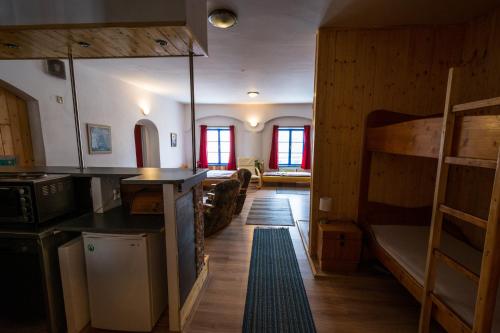 a room with a bunk bed and a living room at Red Point in Tábor