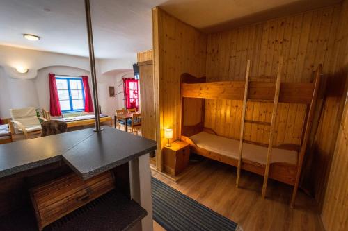 a room with a bunk bed and a living room at Red Point in Tábor