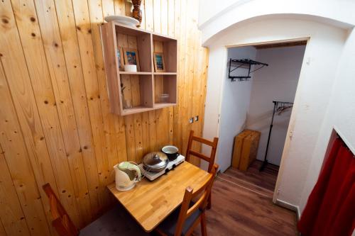 a wooden table in a room with a wooden wall at Red Point in Tábor