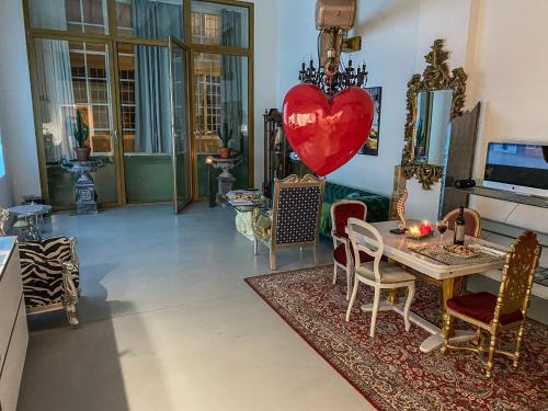 a living room with a heart on the wall at Loft Designer in Neuhausen am Rheinfall