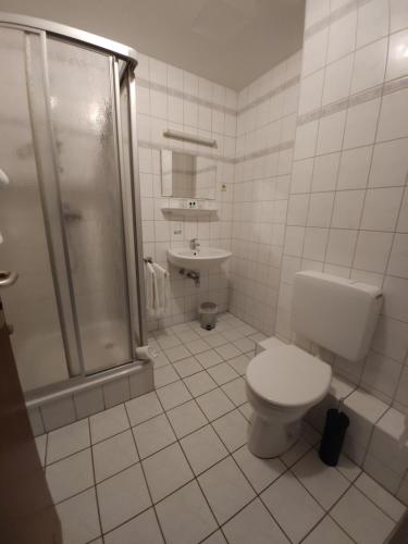 Koupelna v ubytování Hotel Garni