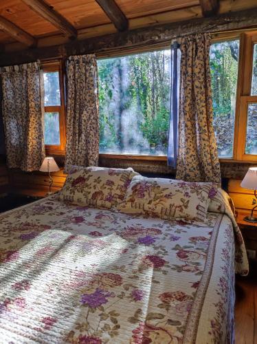 a bedroom with a bed and a window with curtains at Las Terrazas Resort & Apart-Cabañas in La Falda