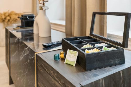 a black box on a counter with a mirror at BOUTIQUE ROOMS I Luxus Suite I Center I Boxspring in Augsburg