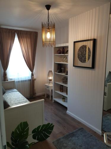 Postel nebo postele na pokoji v ubytování Apartman guru 1