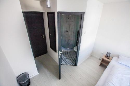 a bathroom with a shower with a glass door at Hotel Rajka in Rajka