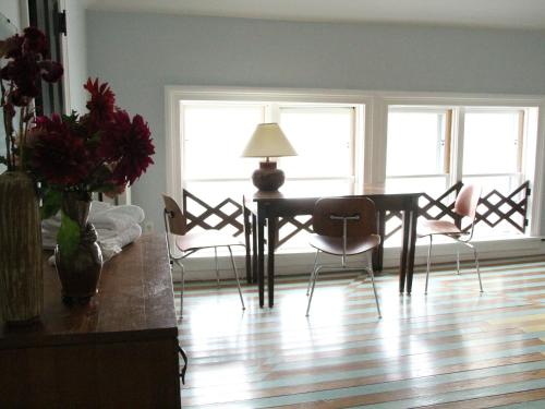 a living room with a dining room table and chairs at The Wedding Cake House in Providence