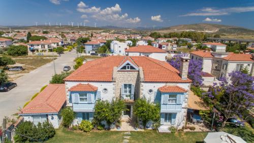 an aerial view of a house with an orange roof at Deniz Kabugu Hotel in Alacati
