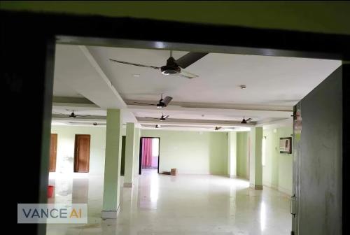 an empty room with green walls and a ceiling at Hotel Geetanjali Palace in Kalyani