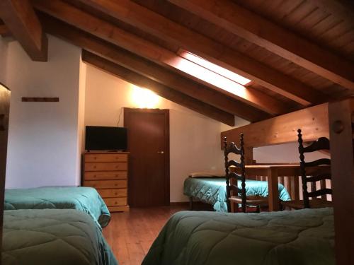 Postel nebo postele na pokoji v ubytování Apartament Dúplex de Can Bota Avet-p