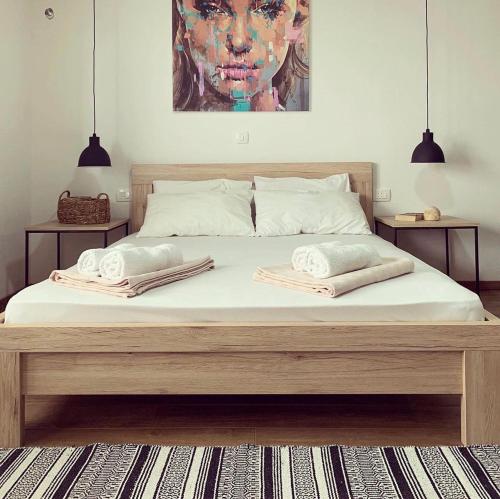 a bed with two pillows on it in a bedroom at Apartments Mrdak in Bar