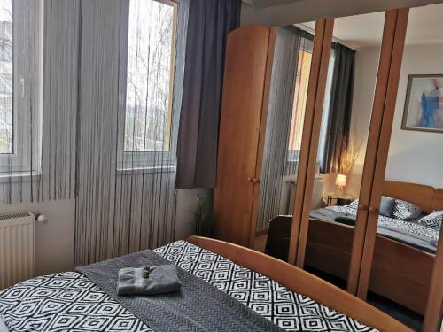 Postel nebo postele na pokoji v ubytování Európa 20 Apartman
