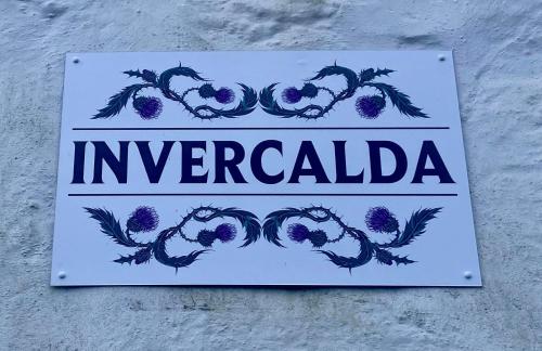 a sign on a building that reads imperiala at Cosy detached house in central location in Oban