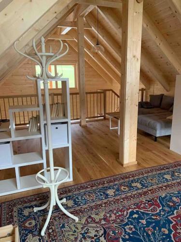 a living room of a wooden cabin with a couch at MyHolzhaus - zum Wohlfühlen in Gröbming