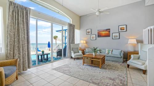 a living room with a view of the ocean at Glunz Ocean Beach Hotel and Resort in Marathon
