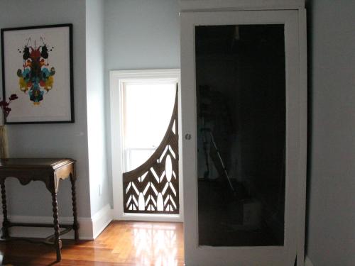a door leading to a room with a window at The Wedding Cake House in Providence