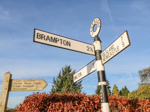 a street sign with two street signs on it at Hadrian's View in Brampton