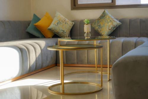 a living room with a couch and two tables at Most Beautiful Apartment in Safi in Safi