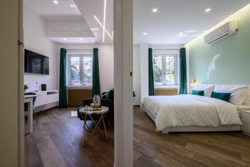 a bedroom with a bed and a desk in a room at Villa In Bed in Naples