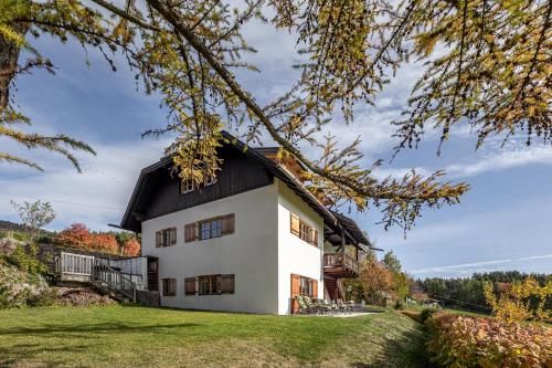 a white house with a black roof at Haus Sophie in Longomoso