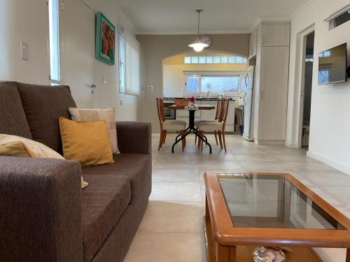 a living room with a couch and a table at Los Zorzales in Villa Carlos Paz