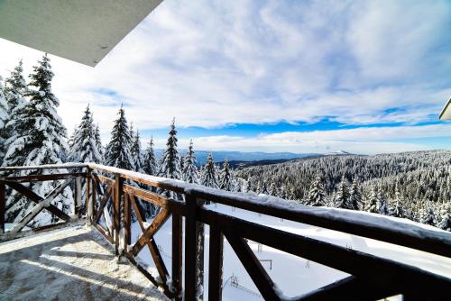 a view from the balcony of a ski resort in the snow at Apartman La Foresta Kopaonik in Kopaonik
